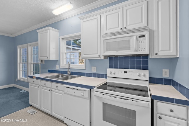 kitchen featuring white cabinets, white appliances, and sink