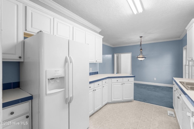 kitchen featuring white cabinets, white appliances, hanging light fixtures, and ornamental molding