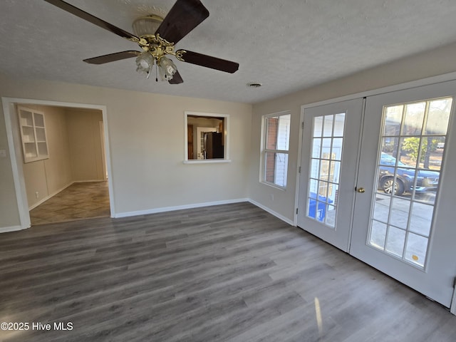 interior space featuring french doors, a textured ceiling, hardwood / wood-style flooring, and ceiling fan