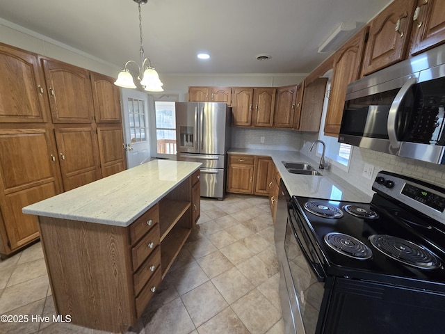 kitchen with appliances with stainless steel finishes, backsplash, sink, a notable chandelier, and a kitchen island