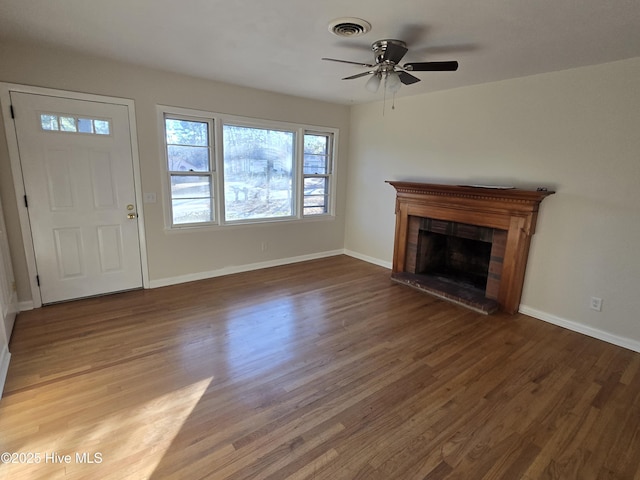 unfurnished living room featuring hardwood / wood-style flooring and ceiling fan