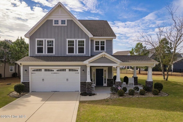 craftsman inspired home featuring a front yard, a garage, and a porch