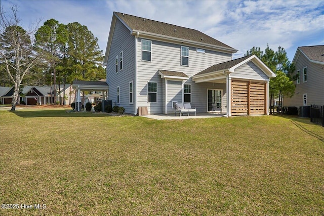 rear view of property with central AC unit, a yard, and a patio