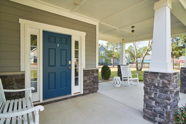 doorway to property with a porch