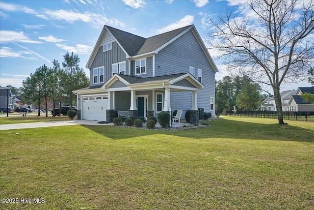 view of front of property featuring a garage, a front yard, and covered porch