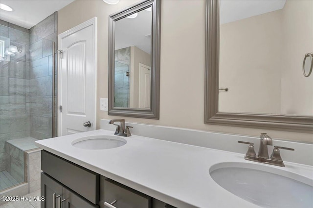 bathroom featuring vanity and an enclosed shower