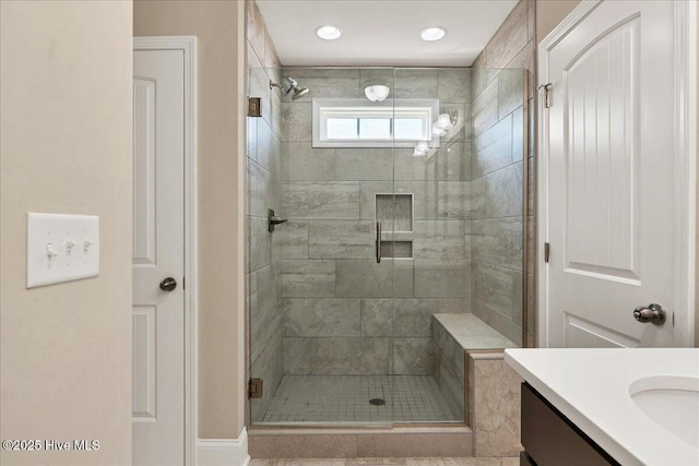 bathroom featuring an enclosed shower, vanity, and tile patterned flooring