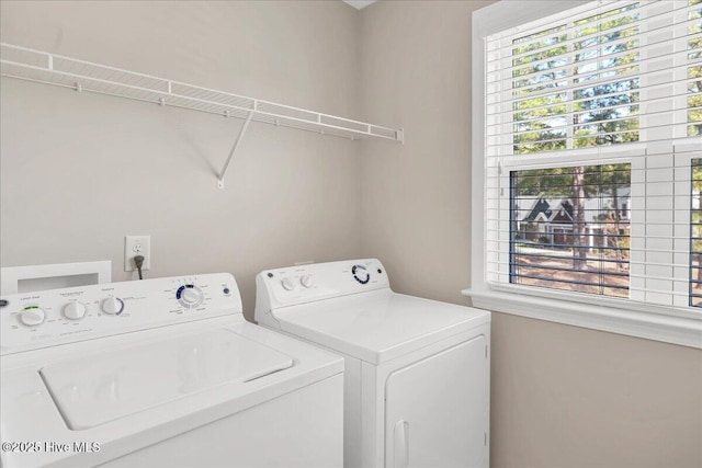 laundry room featuring separate washer and dryer