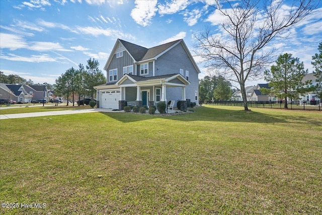 view of front of house featuring a front lawn and a garage