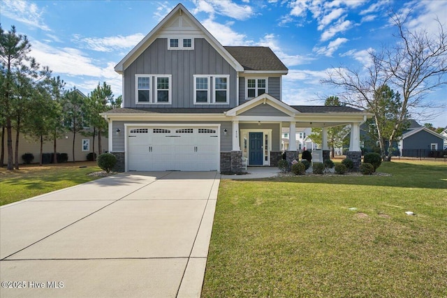 craftsman house featuring a front lawn, a garage, and covered porch