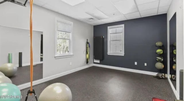 workout area with a paneled ceiling