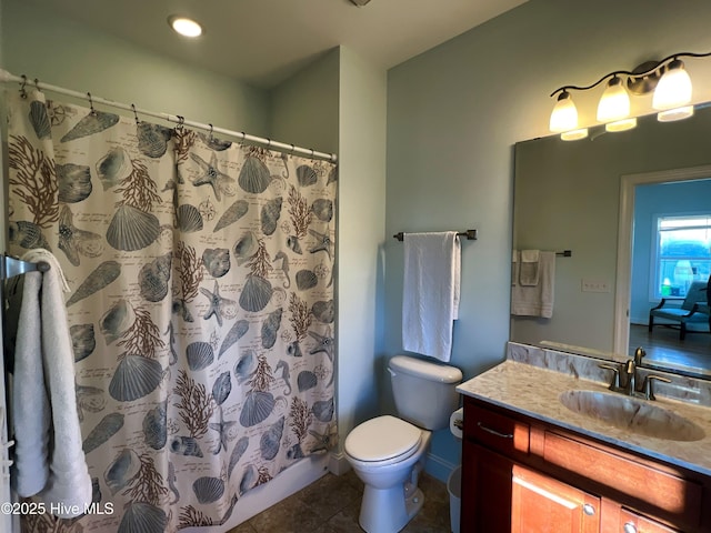 bathroom featuring a shower with shower curtain, tile patterned floors, vanity, and toilet