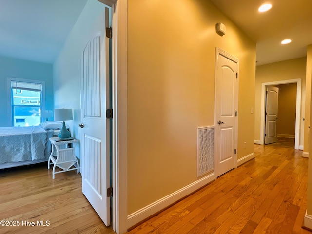 hall with light hardwood / wood-style flooring