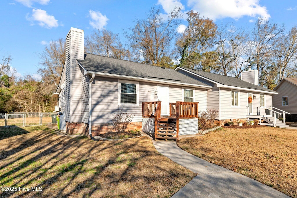 ranch-style home with a front yard