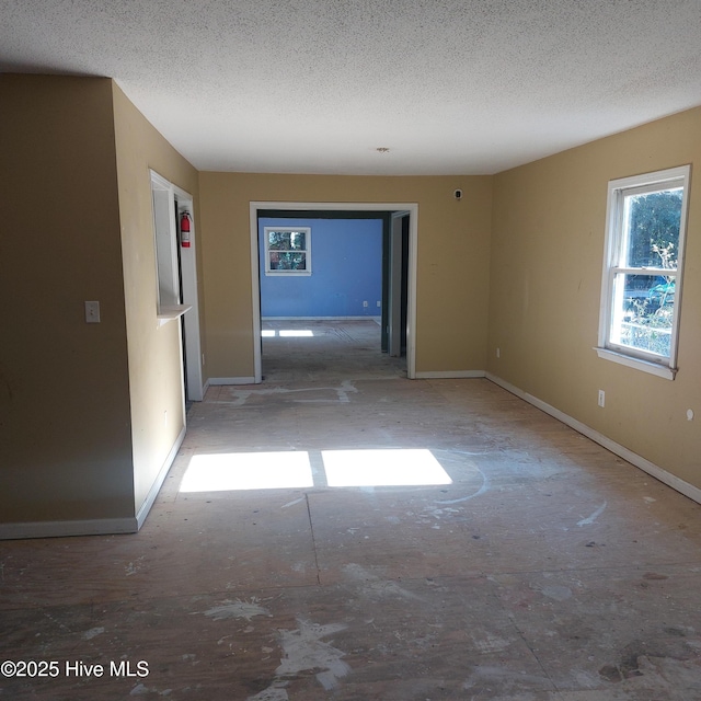 empty room featuring a textured ceiling