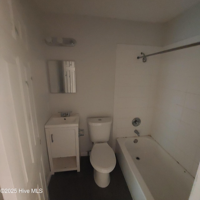 full bathroom featuring vanity, toilet, and tiled shower / bath combo