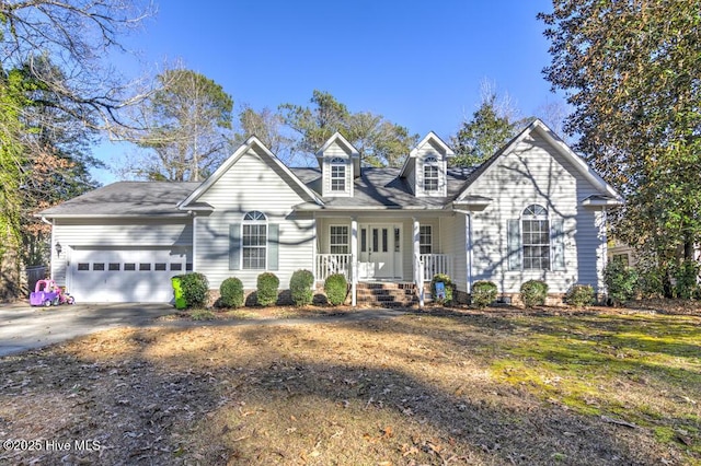 view of front of house featuring covered porch and a garage