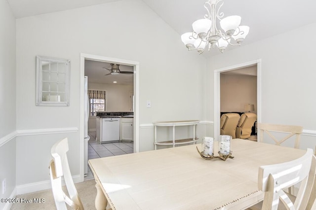 dining area with ceiling fan with notable chandelier and vaulted ceiling