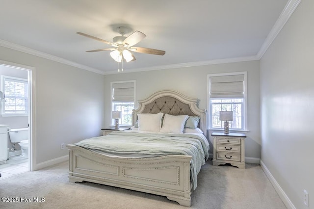 carpeted bedroom featuring ceiling fan, crown molding, and connected bathroom