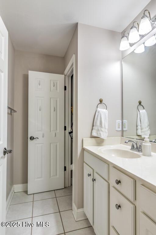 bathroom with tile patterned flooring and vanity