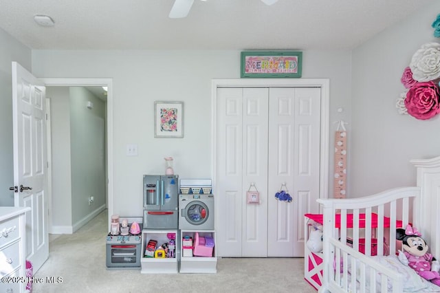 bedroom with a closet, ceiling fan, and light colored carpet