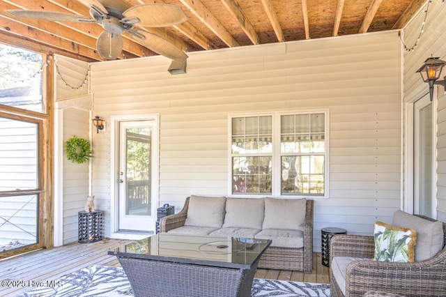 wooden deck with an outdoor hangout area