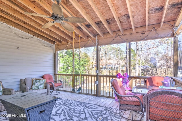 wooden terrace featuring outdoor lounge area and ceiling fan