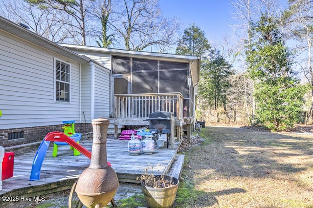 exterior space with area for grilling and a sunroom