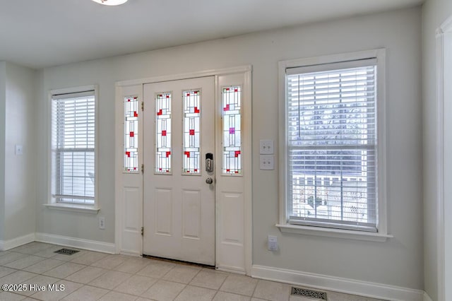 foyer entrance featuring light tile patterned floors