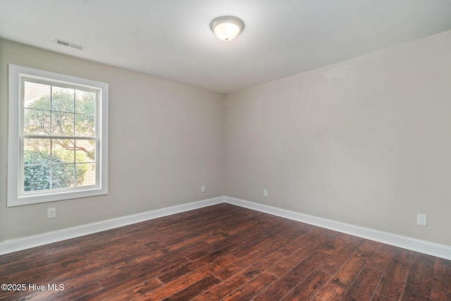 empty room featuring dark hardwood / wood-style floors