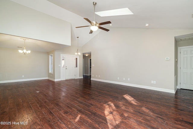 unfurnished living room featuring high vaulted ceiling, a skylight, dark hardwood / wood-style flooring, and ceiling fan with notable chandelier