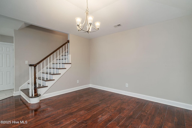 interior space featuring hardwood / wood-style flooring and a notable chandelier