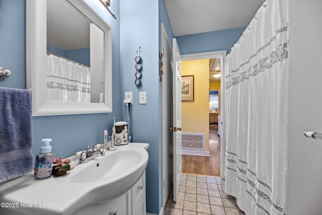 bathroom with tile patterned flooring and vanity