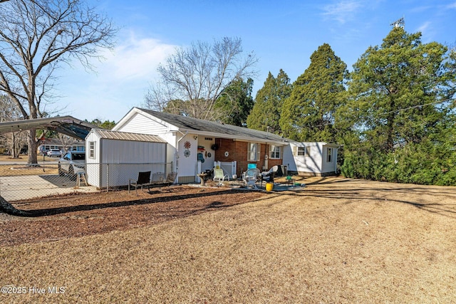 view of front of property with a carport