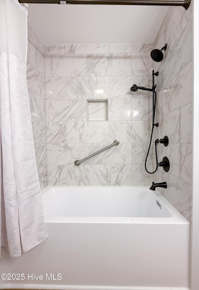 bathroom with shower / tub combo with curtain