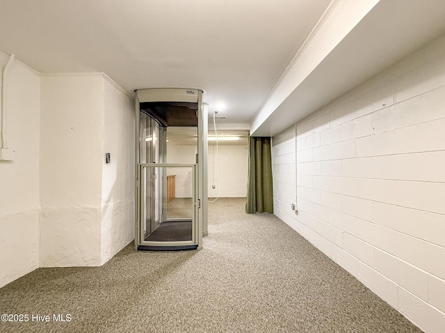 basement with carpet floors and ornamental molding