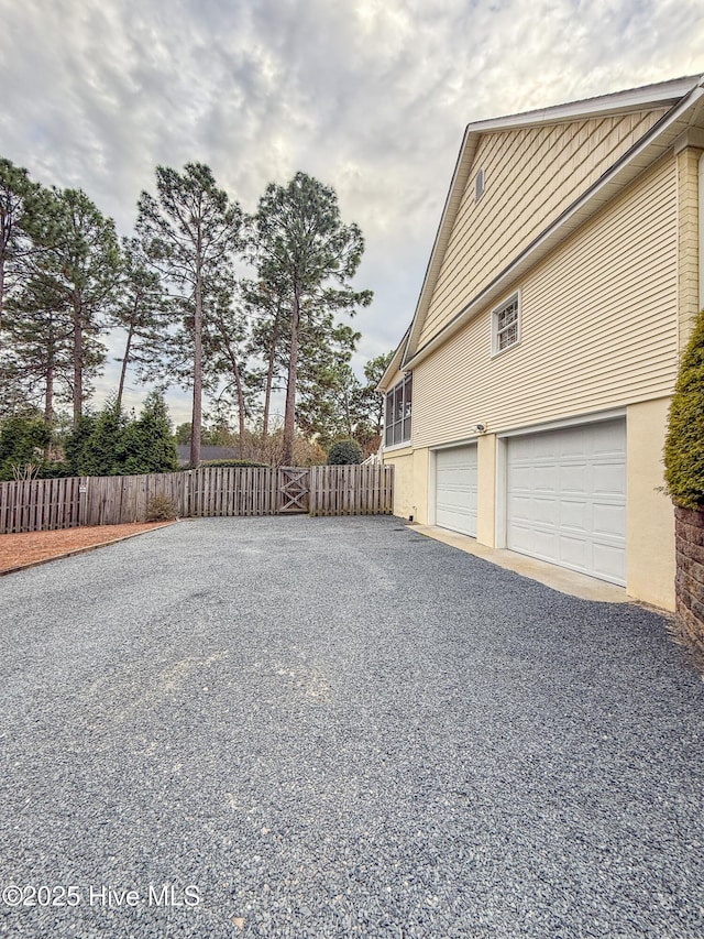 view of property exterior featuring a garage