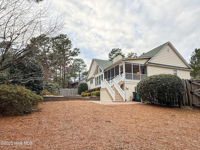 exterior space featuring a sunroom