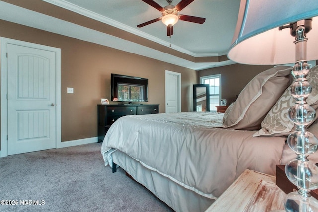 carpeted bedroom with ceiling fan and ornamental molding