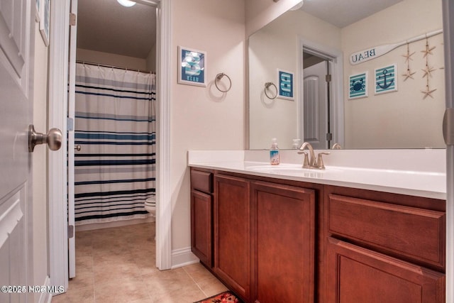 bathroom featuring vanity and curtained shower