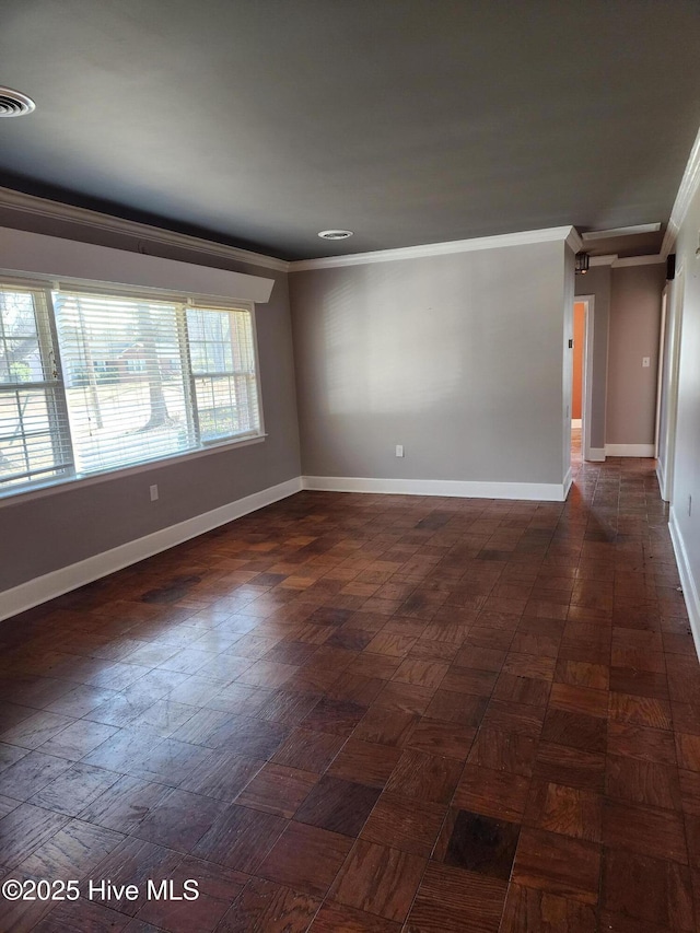 unfurnished room featuring dark parquet flooring and ornamental molding