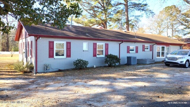 view of side of property with a carport