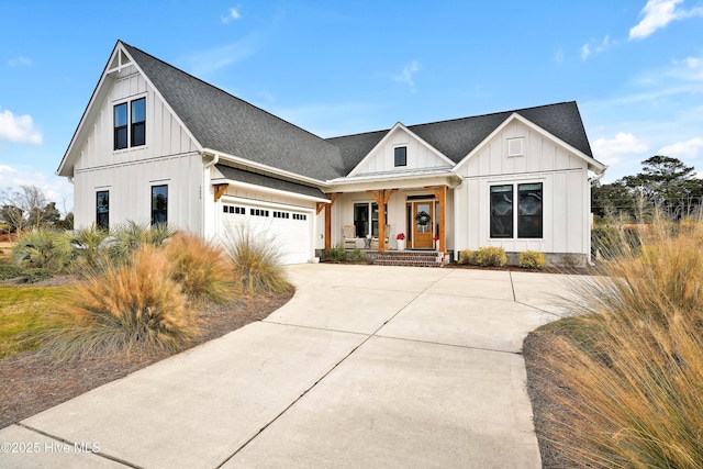 modern farmhouse featuring a porch and a garage