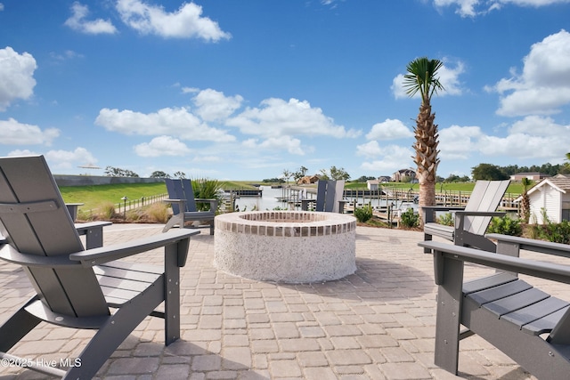 view of patio with an outdoor fire pit