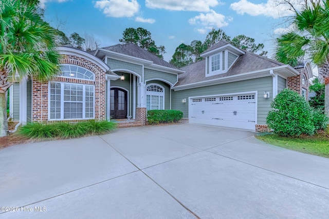 view of front of house featuring french doors and a garage