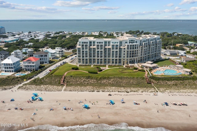 aerial view with a water view and a view of the beach