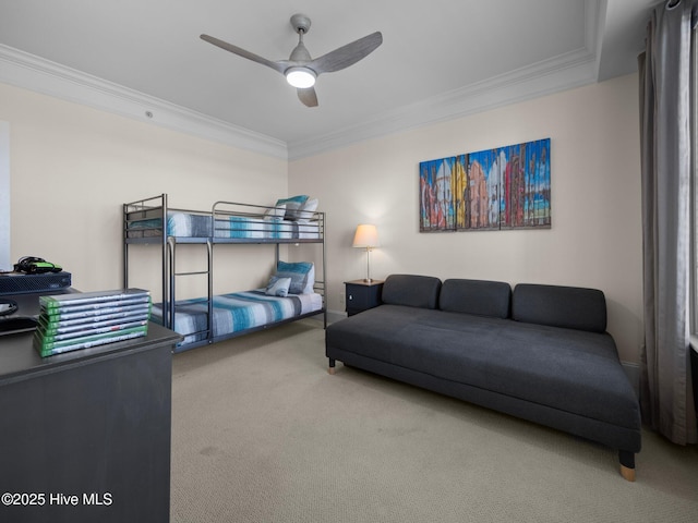 bedroom with carpet floors, crown molding, and ceiling fan