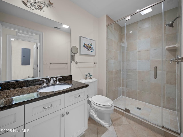 full bath featuring tile patterned floors, toilet, visible vents, a shower stall, and vanity