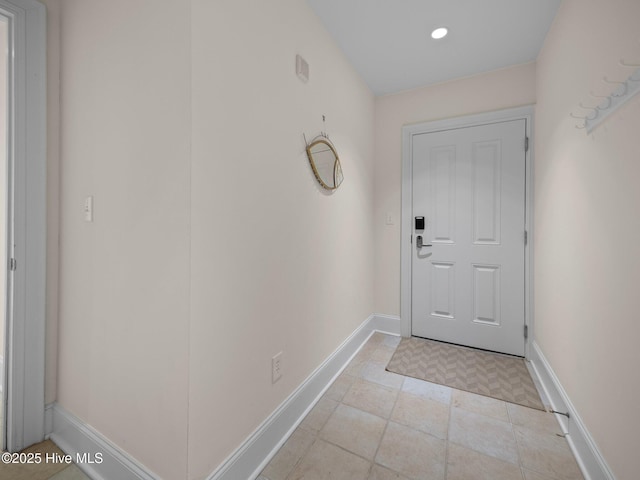 entryway featuring baseboards and recessed lighting