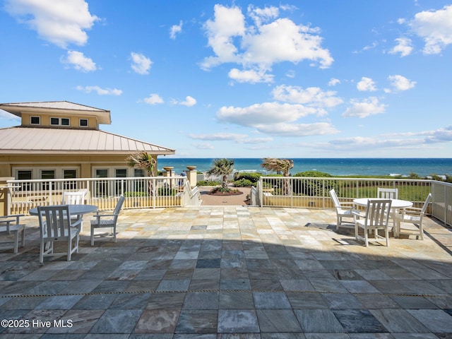 view of patio featuring a water view